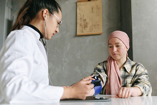 woman gets her blood pressure checked