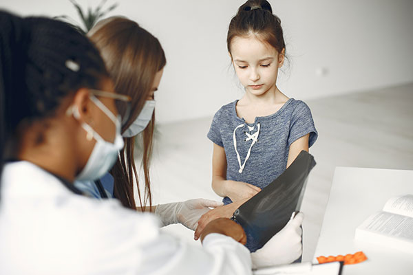 Young girl having a checkup at the doctor